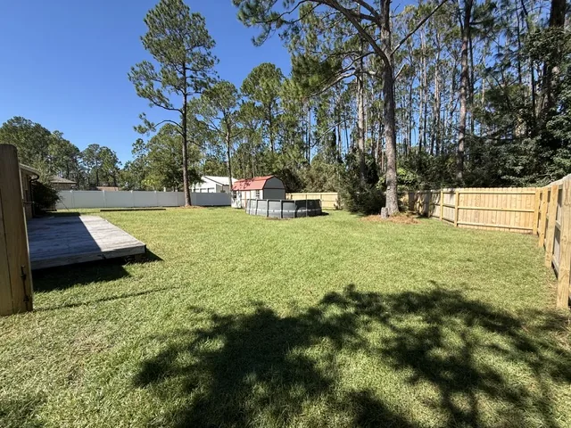 After: pool-side yard cleared and green